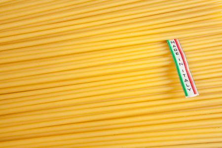 Made in Italy label over uncooked Italian spaghettiの写真素材