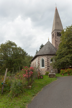 Small Italian little church in wonderful natural environment ( St. Valentino in Val di Funes )の写真素材