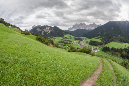Small Italian little town of St. Magdalena in Val di Funes in wonderful natural environmentの写真素材
