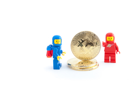 Venice, Italy - January 07, 2018: two astronauts (as Lego figure) standing next to Bitcoin coins, January 07, 2018 in Venice, Italyのeditorial素材