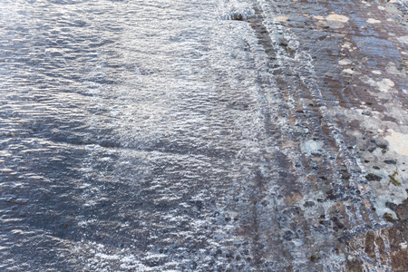a layer of verglas or ice on rocks coul be very dangerous for climbersの写真素材