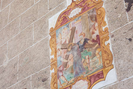 VAL DI FUNES, ITALY - SEPTEMBER 18, 2017: Fresco from the St.Magdalena little church in Val di Funes representing a moment on the Way of the cross. Translation: 2nd Station, Jesus carries his crossのeditorial素材