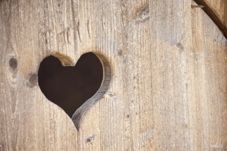 hearth shape over a wooden balcony in a small alpine cabineの写真素材