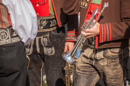 Musician in typical costume during an autumn local celebration in Val Isarco (South Tirol)の写真素材