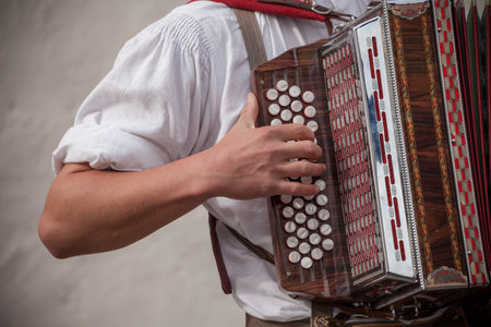 Musician in typical costume during an autumn local celebration in Val Isarco (South Tirol)の写真素材