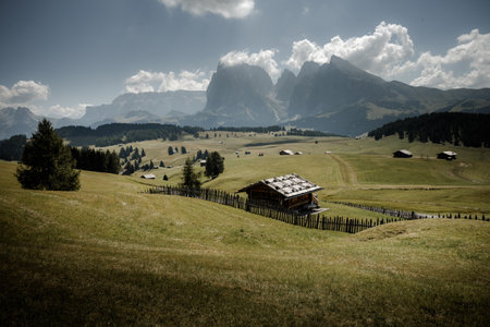 The wide meadows on the northern side of Sciliar mount from the Alpe di Siusi area in the Dolomitesの写真素材