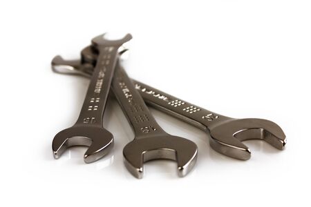 Three open end wrenches isolated on white background. Picture taken in studio with soft-box.
