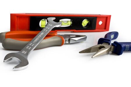 Scattered work tools isolated on white background. Still-life picture taken in studio with soft-box.の写真素材