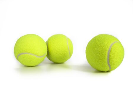 Tennis balls isolated on white. Still-life photo taken on studio with white background and softbox.の写真素材