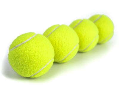 Tennis balls isolated on white. Still-life photo taken on studio with white background and softbox.の写真素材