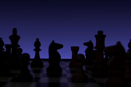 Knight in a chess duel on the chessboard. Low-key concept picture of chess pieces taken in studio and concerning decision making and strategy.の写真素材