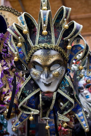 Venetian carnival mask, hanging on exhibitor in Venice, during the carnival celebration.のeditorial素材