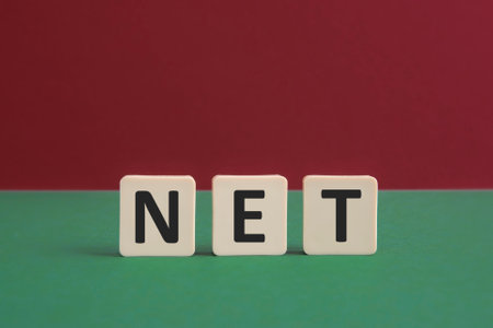 Word NET written with leisure game tiles. Conceptual image representing a textual message communicated using letters from a board game.の写真素材