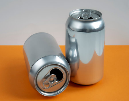 Two aluminum cans for beverage. Still-life picture of some metallic containers.の写真素材