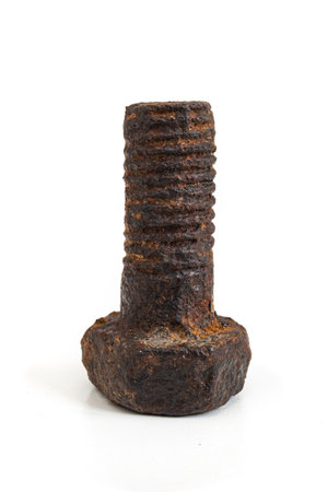 Rusty metal bolt. Mechanical component worn out by time and covered in rust isolated on white background.の写真素材