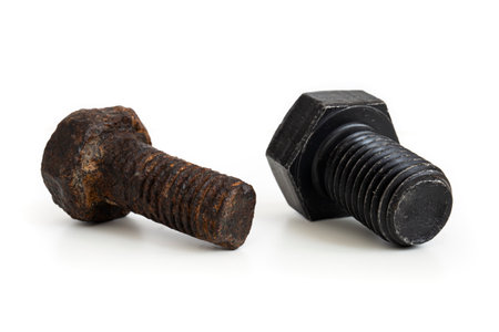 New bolt and rusty bolt. Still-life picture of a mechanical component taken on studio with white background and softbox.の写真素材