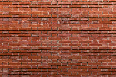 Red brick wall. Architectural seamless pattern of a wall. Textured background with copyspace.の写真素材