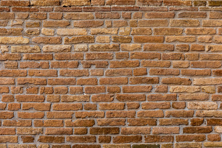 Red brick wall. Architectural seamless pattern of a rustic wall. Textured background with copyspace.の写真素材