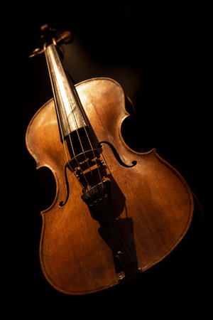 Violin. Low-key picture of an old-fashioned musical instrument.の写真素材
