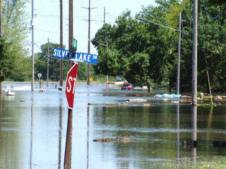 Waterloo,Iowa  ,June 10,2008-Historical flooding.A flooded street with street signs.