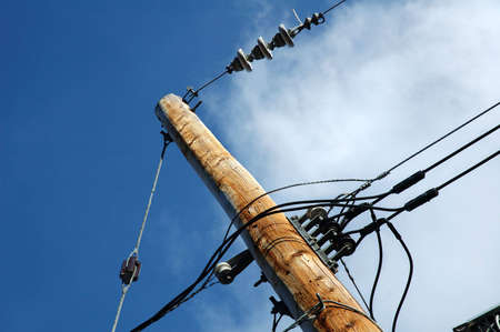 Electrical post outdoors with blue sky at the backgroundの写真素材