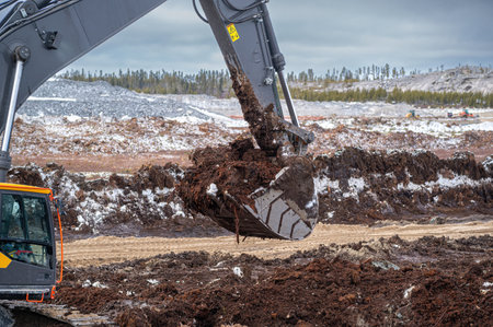 Excavator bucket filled with peatの写真素材