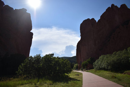 Garden of the Gods walking path with greenery and sunbeamsの写真素材