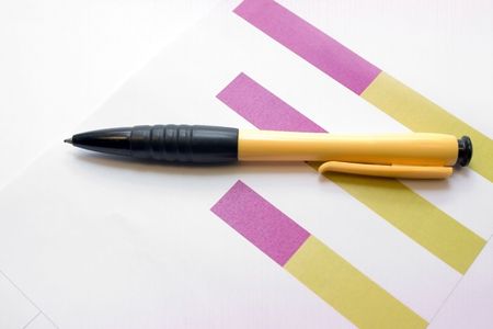 yellow-black ball-point pen on the graphic coloured diagram