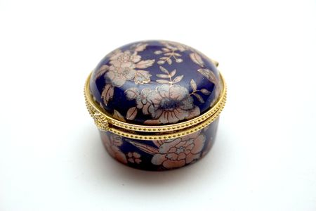 round dark blue small box on a light backgroundの写真素材