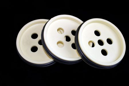 white plastic wheels on a black background