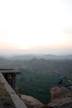 kind during sunset on mountains from the ancient Indian temple complexの写真素材
