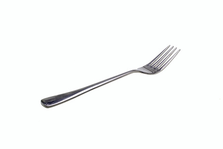 Silver fork on white backgroundの写真素材