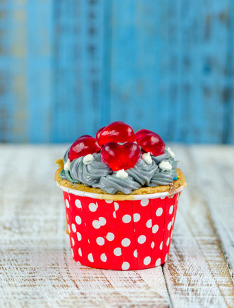 Colorful cupcakes on a wooden backgroundの写真素材