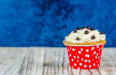Colorful cupcakes on a wooden backgroundの写真素材
