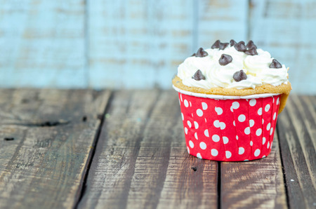 Colorful cupcakes on a wooden backgroundの写真素材