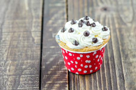 Colorful cupcakes on a wooden backgroundの写真素材