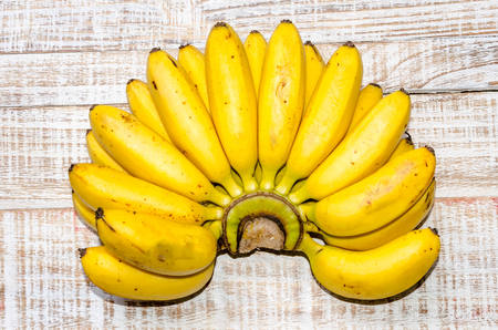 Fresh bananas on wooden backgroundの写真素材