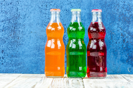 variety of soda bottle on the wooden backgroundの写真素材