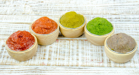 varity Thai cuisine nam prik or chili paste spices of Thailand in cup ready for cooking thai foods on wood vintage backgroundの写真素材