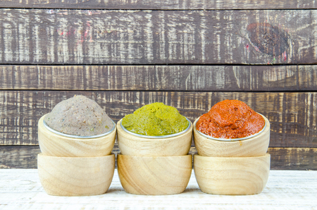 varity Thai cuisine nam prik or chili paste spices of Thailand in cup ready for cooking thai foods on wood vintage backgroundの写真素材
