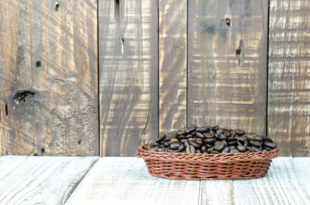 Coffee beans on grunge wooden backgroundの写真素材