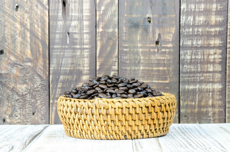 Coffee beans on grunge wooden backgroundの写真素材