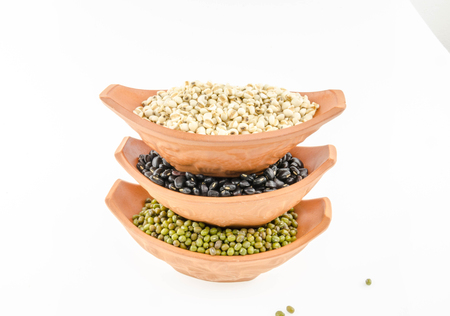 A variety of nuts in cups On a white background