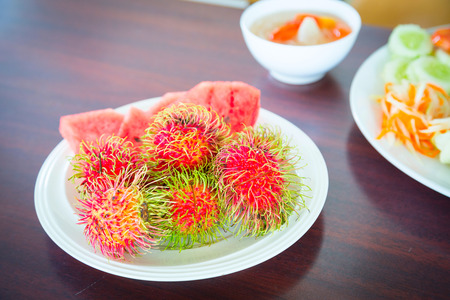 Rambutan on the plate. Ripe. Redの写真素材