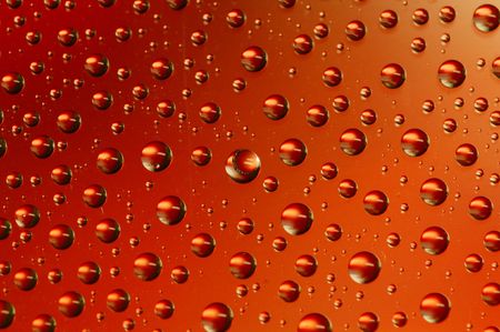 colored drops on the glassの写真素材