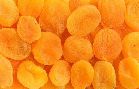 dried orange apricots. background texturedの写真素材