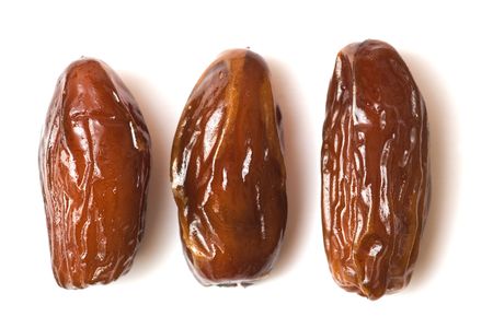 dates isolated on white, dried fruitsの写真素材