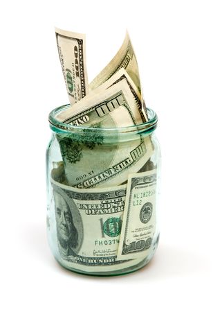 dollars in glass can isolated on whiteの写真素材