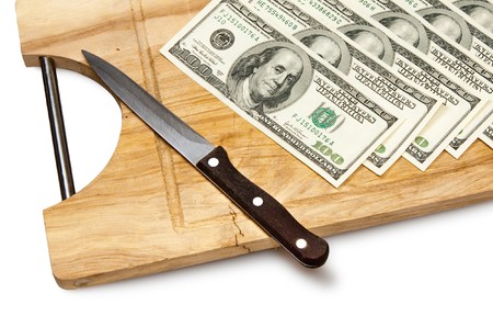 cutting money on board, dollarsの写真素材