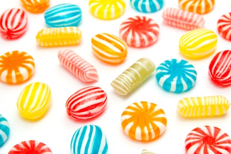 many different color candies on whiteの写真素材